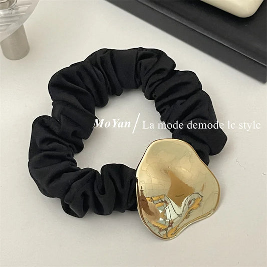 Elegant Black Silk Scrunchie with Gold Metal Accent – Geometric Hair Band