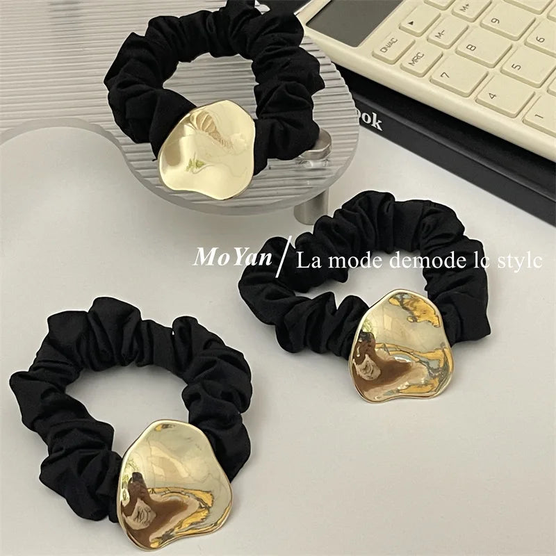 Elegant Black Silk Scrunchie with Gold Metal Accent – Geometric Hair Band