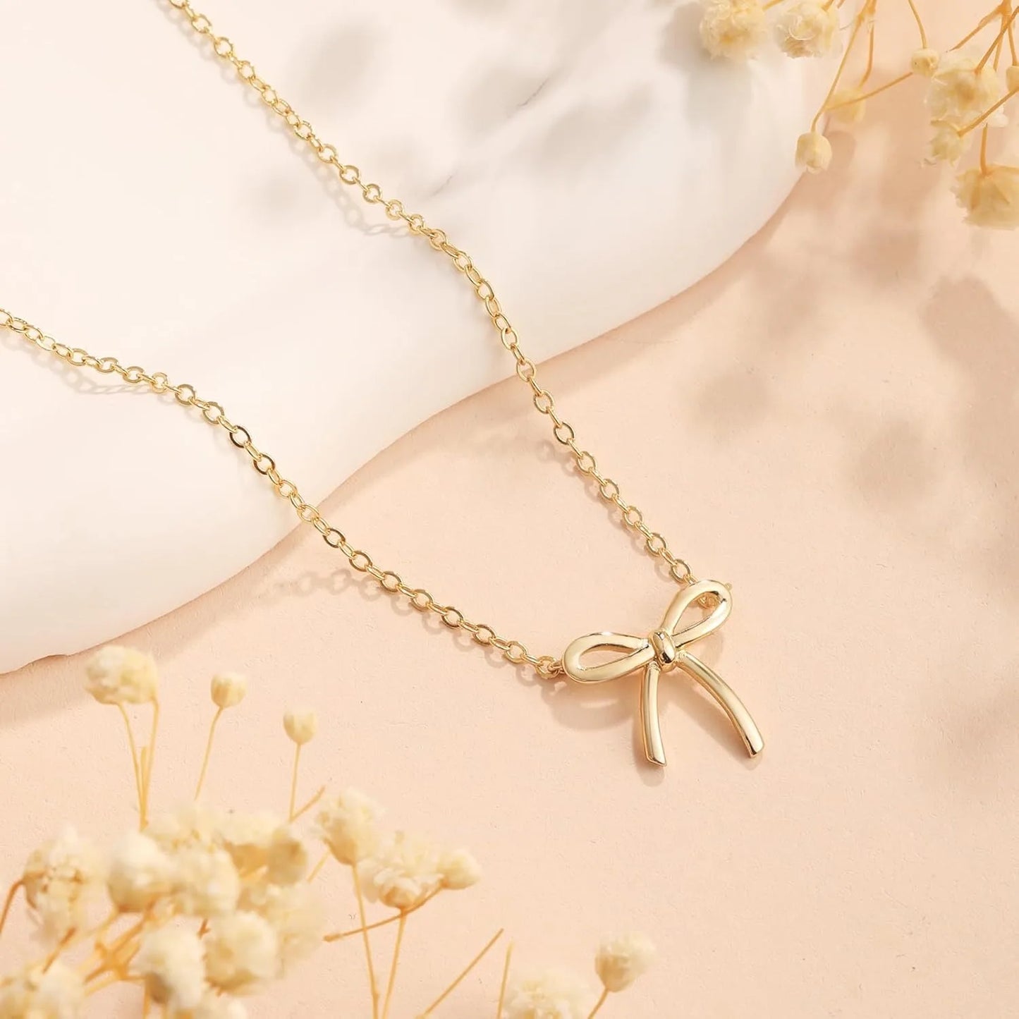 Elegant Bow Pendant Necklace – Gold & Silver Options